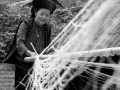 Ha Giang - Hmong woman spinning hemp