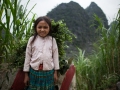 Ha Giang - Young Hmong carrying grass